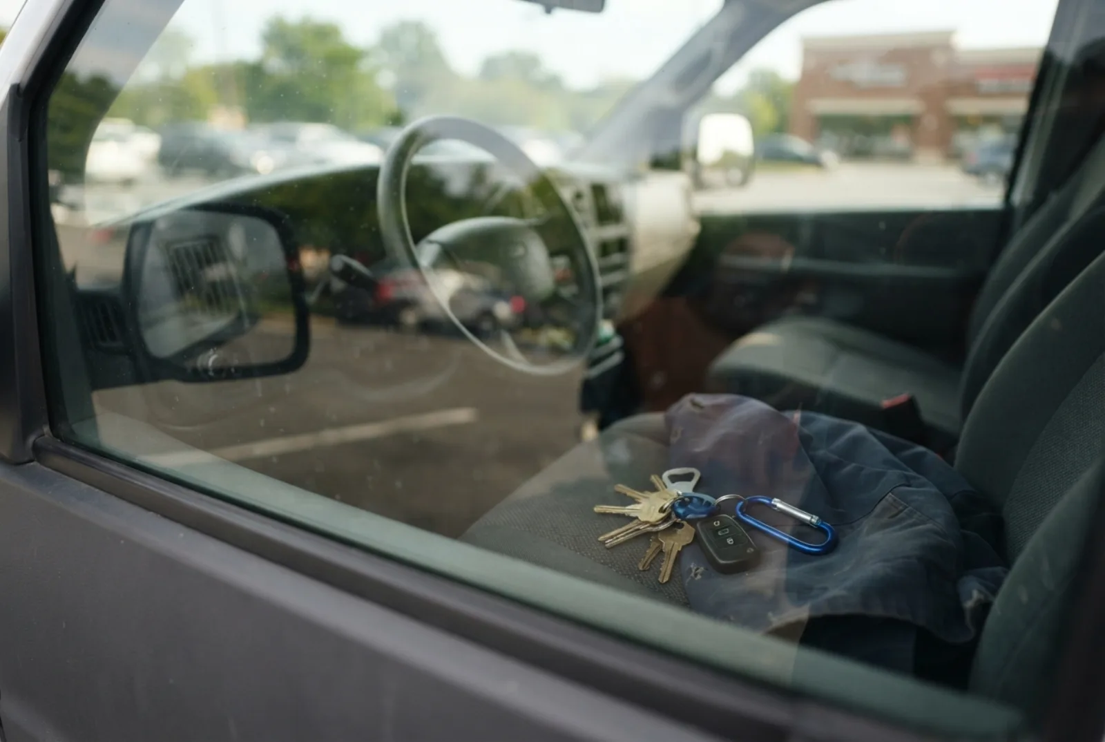 Locked out of your car in Rockville: keys visible on the seat of a locked car